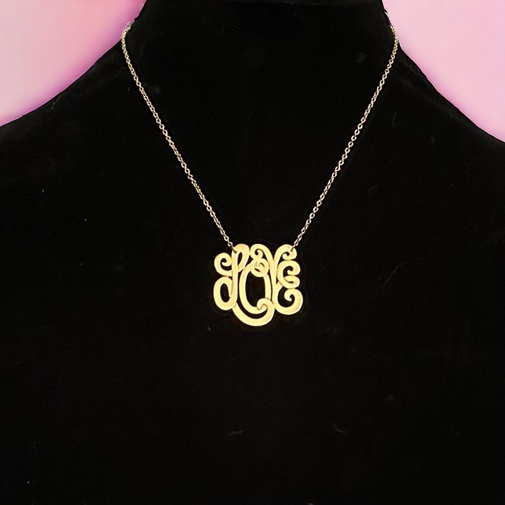 Gold tone monogram script Love necklace